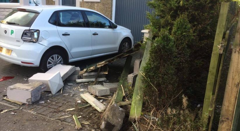 Police hunt driver after car smashes through garden