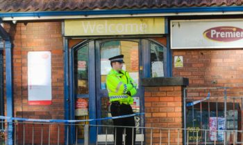 Police stand guard at Sandys Post Office in Granton. 