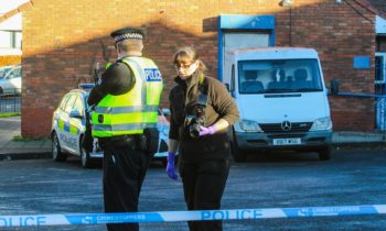 Police stand guard at Sandys Post Office in Granton.