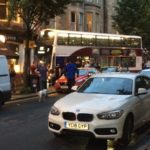 Forrest Road closed after bus mounts pavement and crashes into building