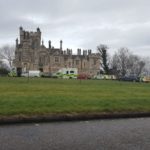 A man has died after falling from the roof of a building in North Edinburgh